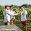 Guys tasting wine on the vineyard