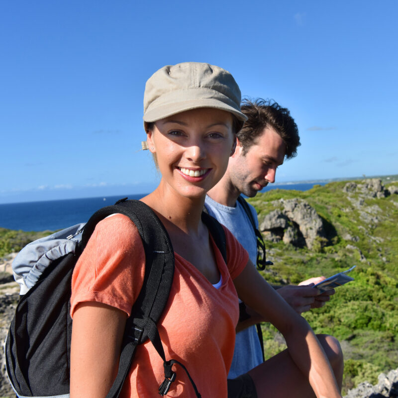 Couple of hikers looking at map and scenery. Hiking day on West Coast Western Australia on our Western Australia tours. perth to exmouth tour one way