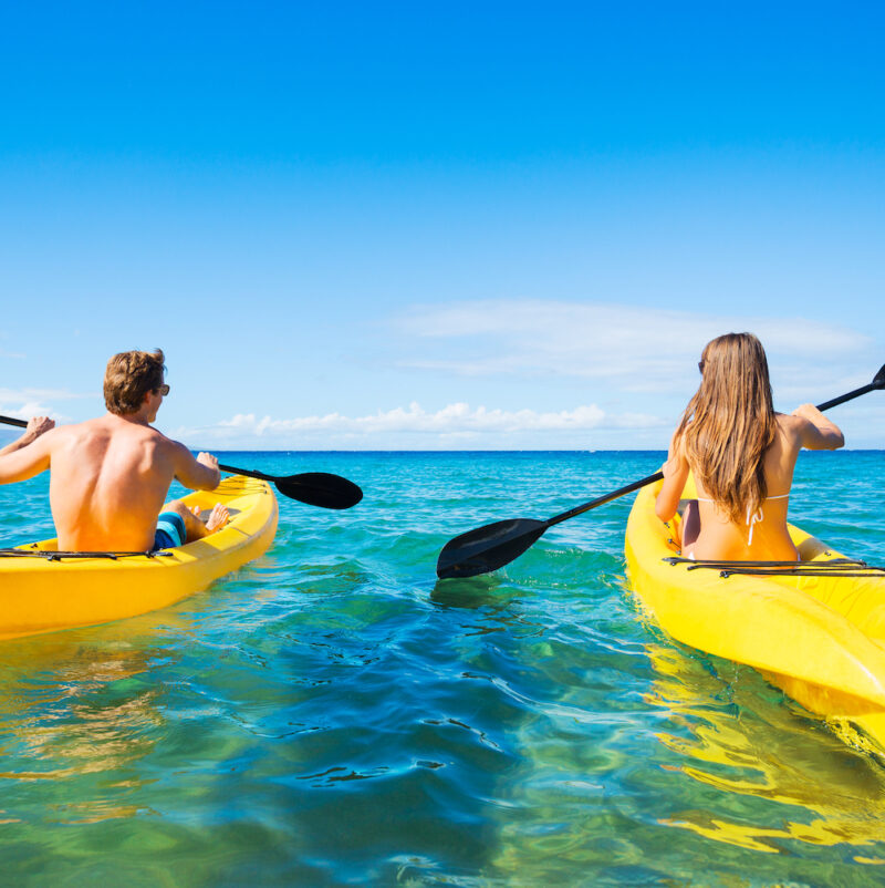 Real Aussie Adventures, Small Group Adventure Tours Australia. Couple Kayaking in the Ocean on Vacation