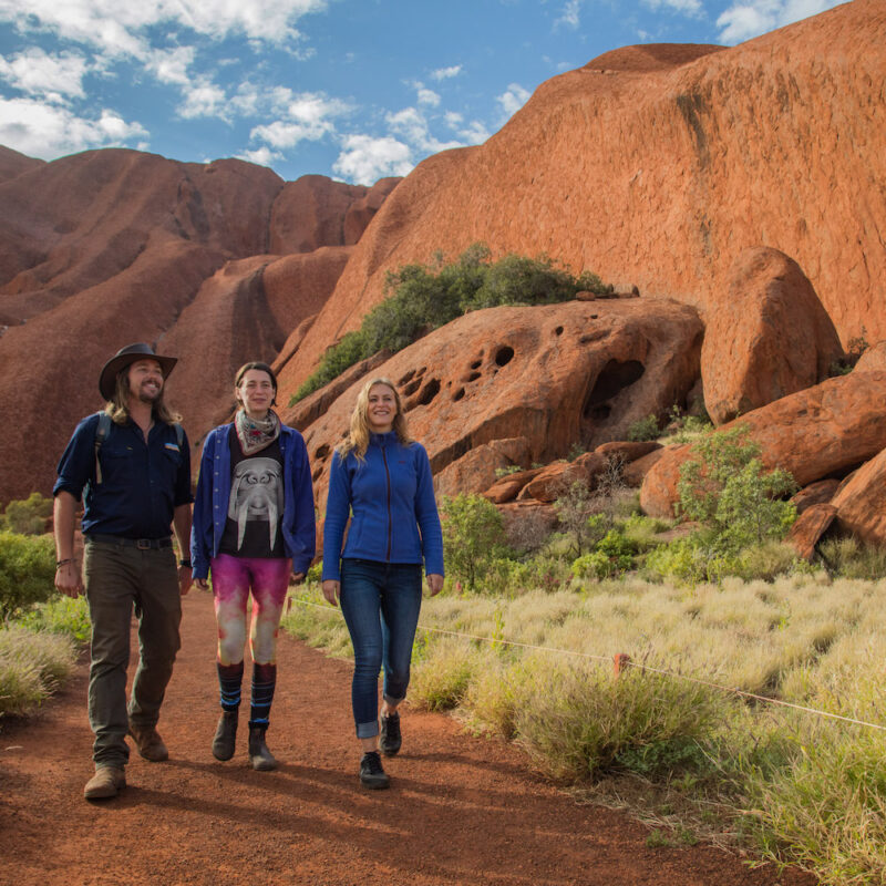 Walking Uluru with tour guide in Uluru on our Northern Territory tours.
