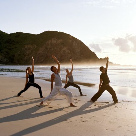 Sunrise yoga class on the beach at Byron Bay