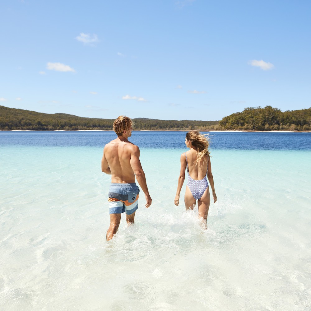 Real Aussie Adventures, Small Group Adventure Tours Australia. Couple in the water at Lake McKenzie, Fraser Island