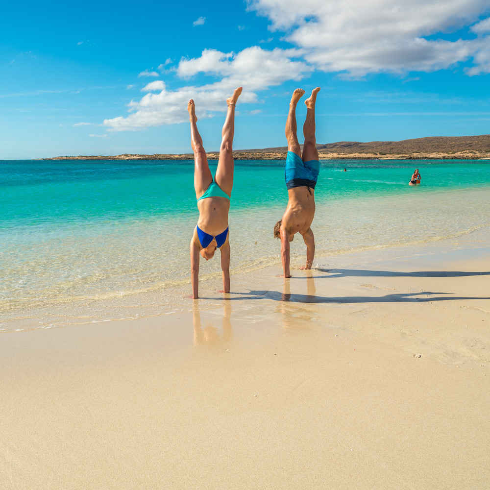 Turquoise Bay handstand on the beach on our Perth to Exmouth tour. Western Australia