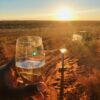 Glass of bubbles. Sunset at Uluru on our Northern Territory tours.