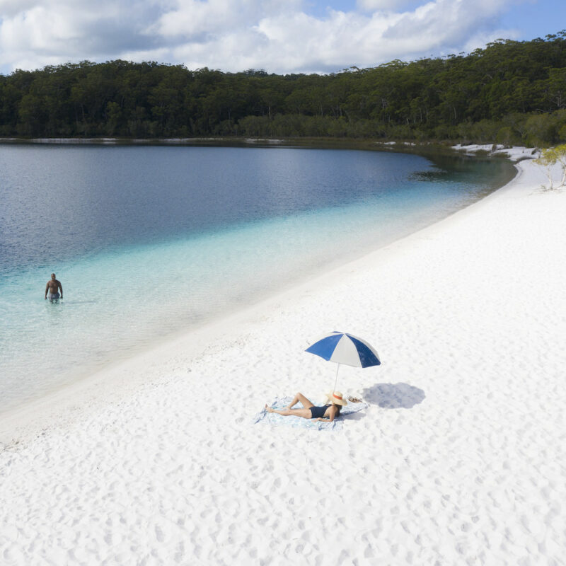 Real Aussie Adventures, Small Group Adventure Tours Australia. Couple swimming in the lake on our Fraser Island tours.