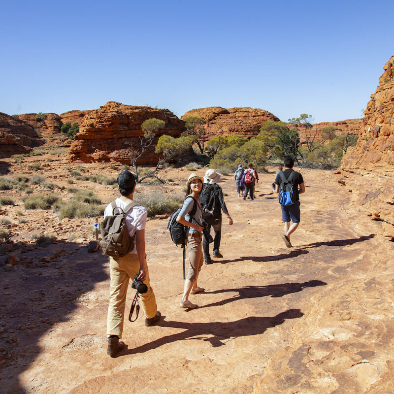 Real Aussie Adventures, Small Group Adventure Tours Australia. Asian tourists exploring Kings Canyon on our Outback Red Centre tours