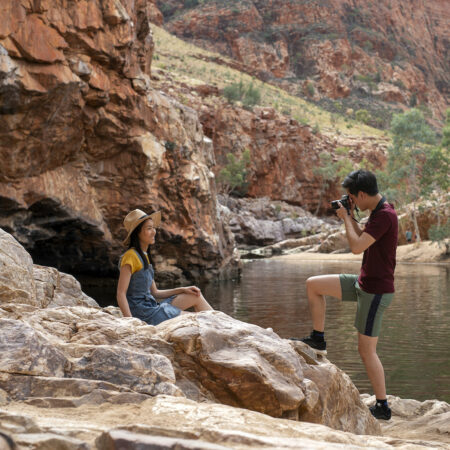 Real Aussie Adventures, Small Group Adventure Tours Australia. Man taking a photo of woman at Ormiston Gorge on our Northern Territory Tours.
