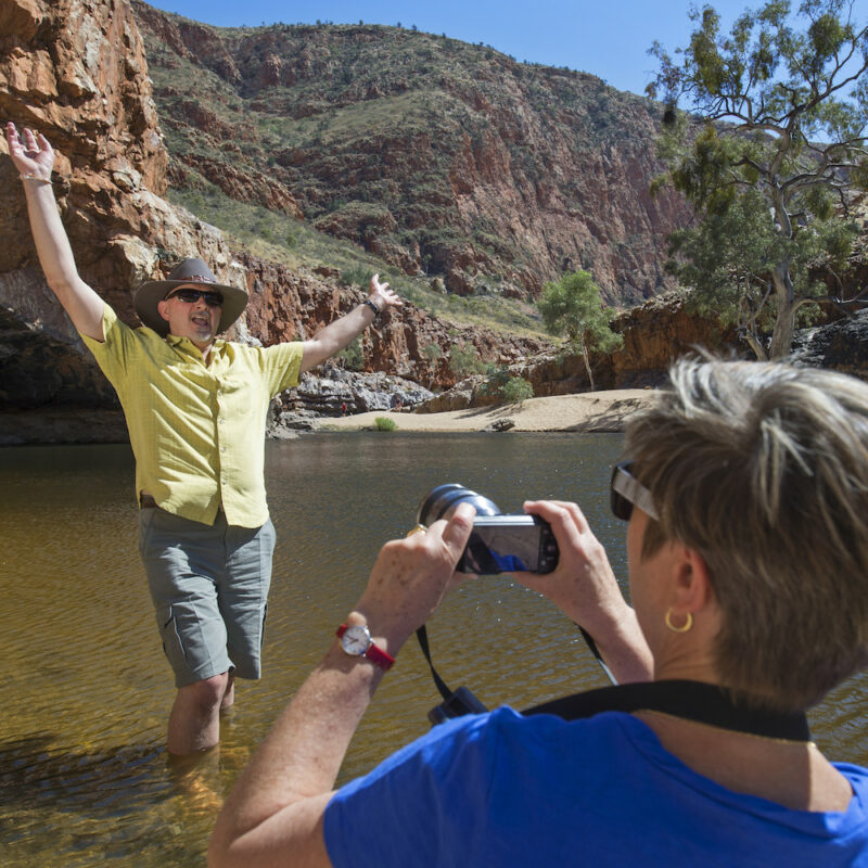 Real Aussie Adventures, Small Group Adventure Tours Australia. Visitors viewing the unique landscape of Ormiston Gorge. Sightseeing at Ormiston on. our outback Red Centre tours