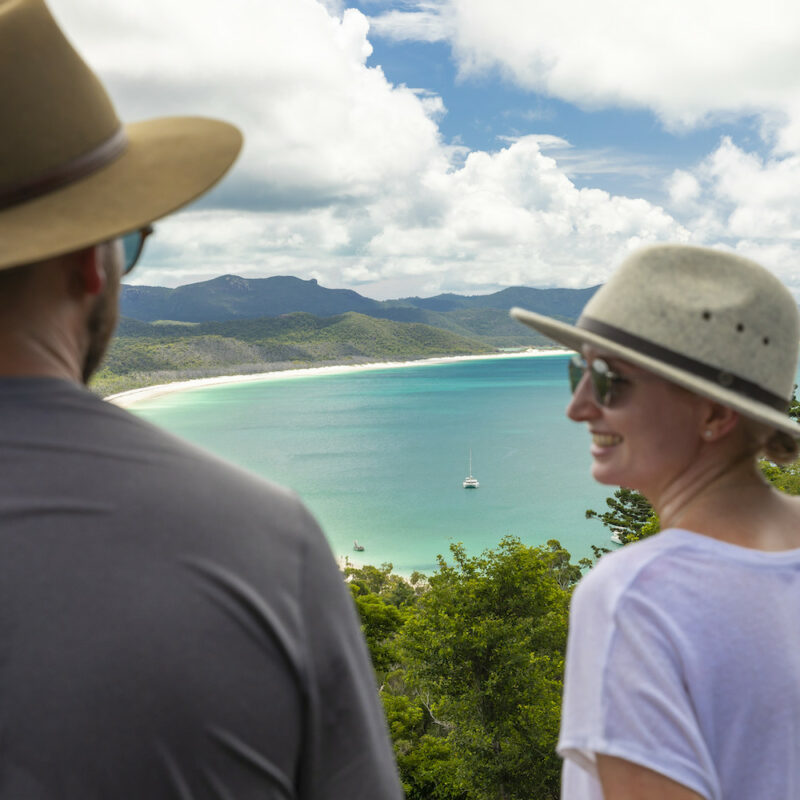 South Whitehaven Beach couple looking out at the Whitsundays on a Whitsunday 3 day cruises