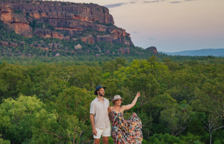 Real Aussie Adventures, Small Group Adventure Tours Australia. Couple at Nawurlandja lookout on our 4 day Kakadu National Park Tour from Darwin kakadu katherine and litchfield adventure