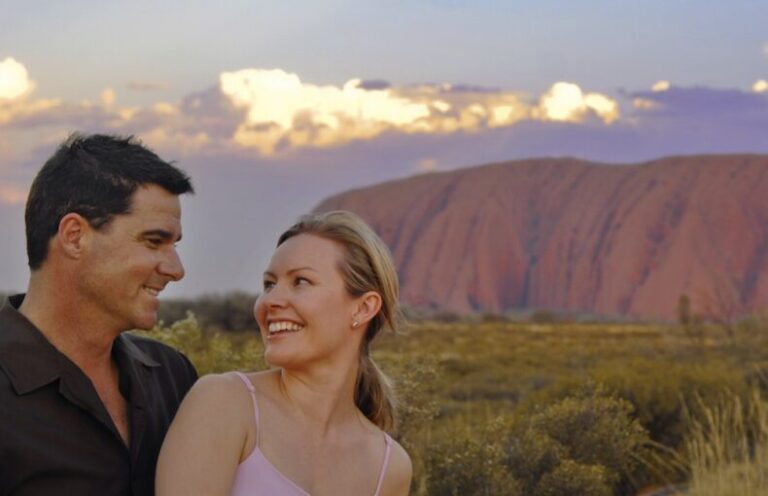 Real Aussie Adventures, Small Group Adventure Tours Australia. Couple at Uluru. NT Uluru Kata Tjuta National Park Northern Territory Tours.
