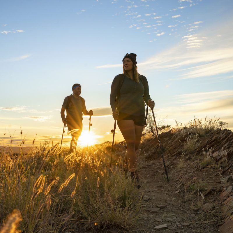 People hiking along the Larapinta Trail at Euro Ridge at sunrise, in fantastic light, Real Aussie Adventures