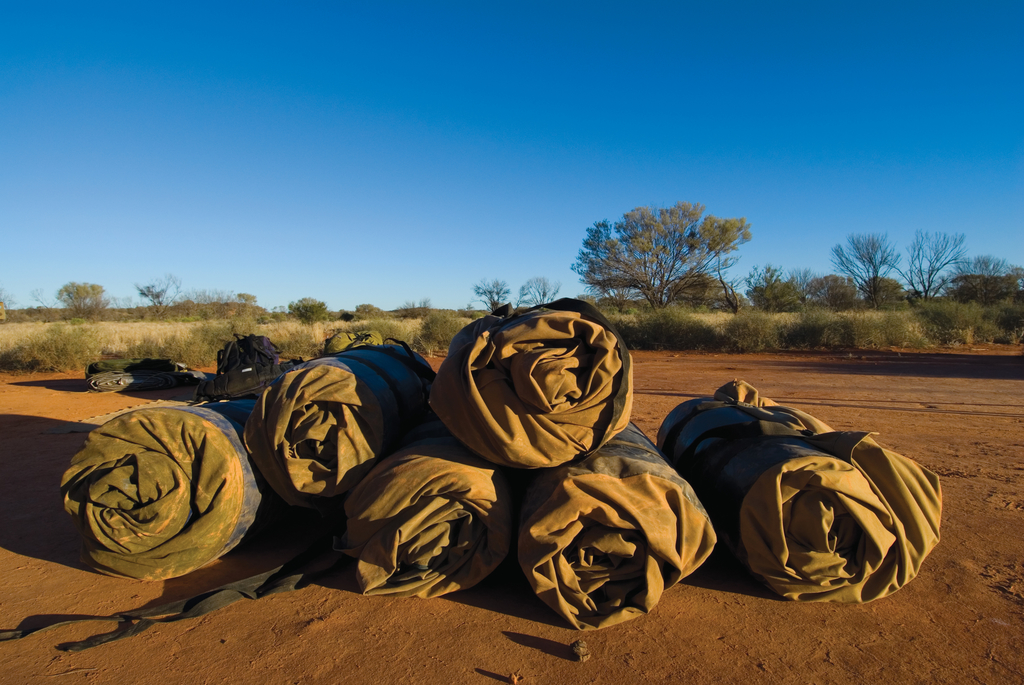 Australian Swag Camping. A pile of 6 rolled up swags in the outback Australia.